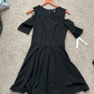 Black Bloomingdale’s aqua cocktail dress